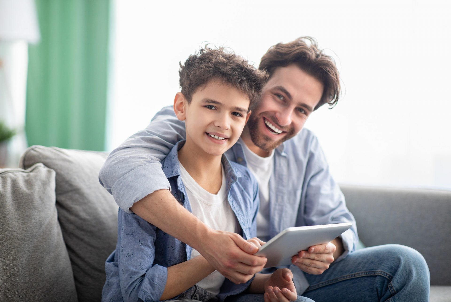 family-time-happy-dad-and-son-using-digital-tablet-browsing-internet-online-at-home-sitting-e1632233068896.jpg family-time-happy-dad-and-son-using-digital-tablet-browsing-internet-online-at-home-sitting-e1632233068896.jpg